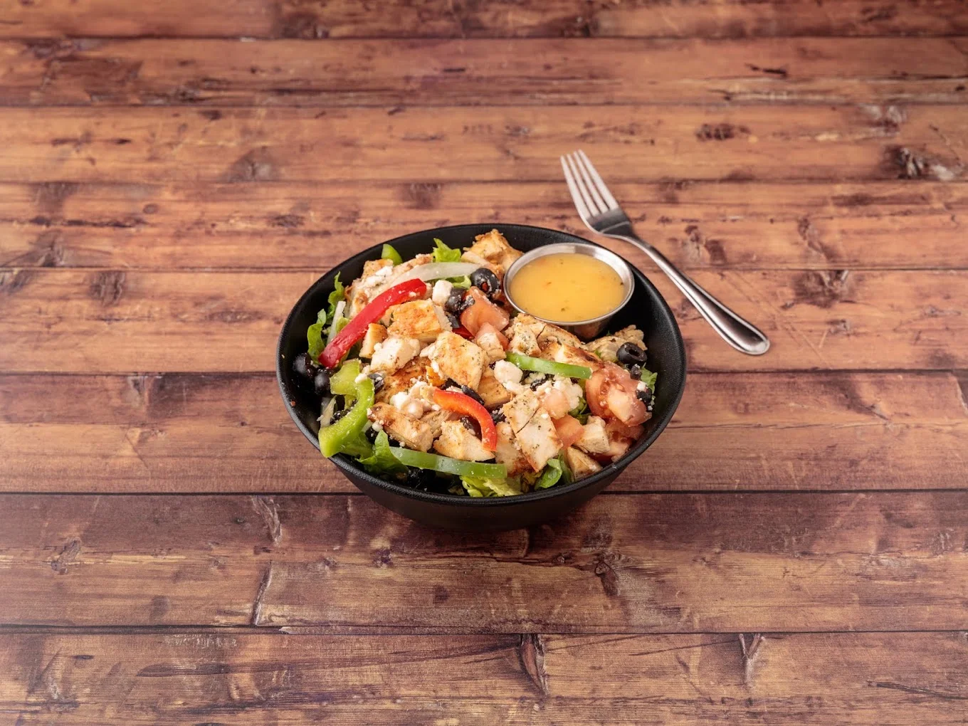Grilled chicken salad with feta and olives from Daisy's Pizza